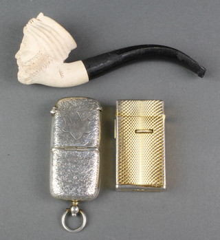 An Edwardian chased silver vesta/sovereign case 2 1/2", Birmingham 1905 together with a Meerschaum pipe and a cigarette lighter 