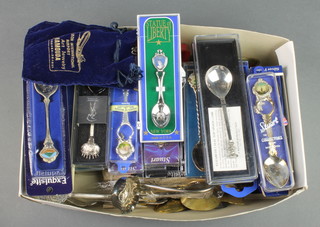 A quantity of silver plated souvenir spoons