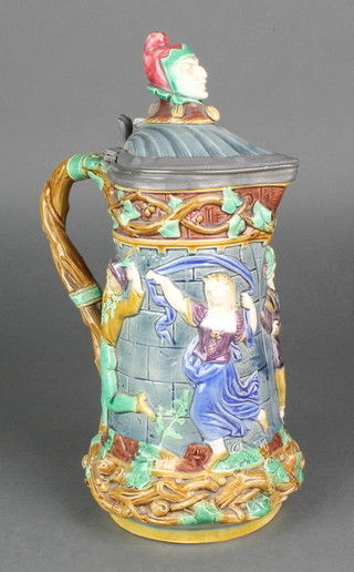 A 19th Century Minton Majolica jug with revelling scene and pewter mounts and impressed marks 12" 
