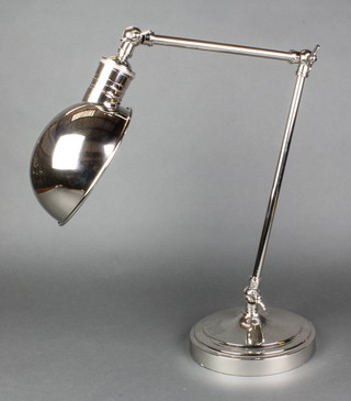 A plated student's adjustable table lamp on a circular base 
