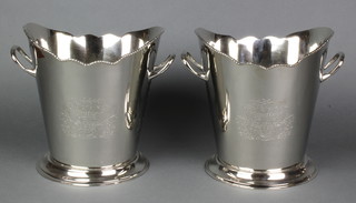 A pair of plated 2 handled wine coolers with armorial decoration 8" 