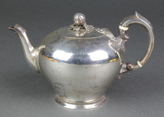 A mid Victorian silver melon shaped teapot with fruit finial and scroll handle with ivory resistors, London 1842, 375 grams