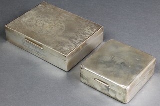 A silver engine turned cigarette box, London 1963 5 1/2" x 4", a square ditto Birmingham 1937 3 1/2" 