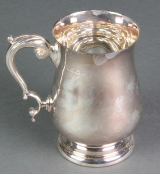 A silver baluster mug with fancy S scroll handle Birmingham 1990, 400 grams, 5" 