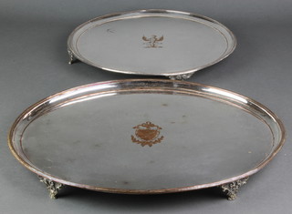 A 19th Century oval Sheffield plated tray with chased armorial 18", a circular ditto with beaded rim 14 1/2" 