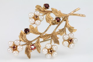 A 9ct pearl and garnet floral spray brooch, gross 10 grams 