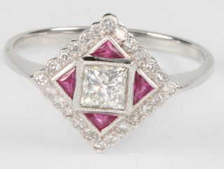 An 18ct white gold ruby and diamond Art Deco style ring, size N 1/2
