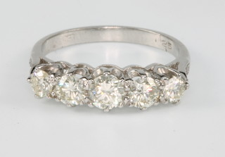 An 18ct white white gold 5 stone diamond ring, approx 1.25ct, size L 1/2