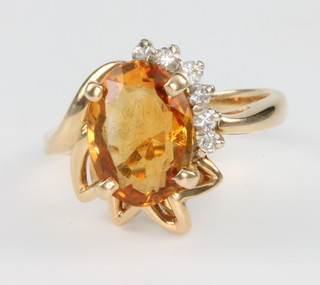A 14ct yellow gold citrine and diamond cocktail ring, size L 