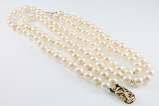 A cultured pearl double row necklace with gold clasp 15"
