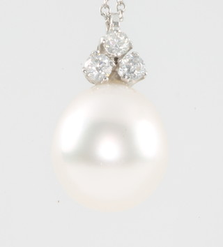 A pearl pendant with diamond set mount on an 18ct white gold chain 