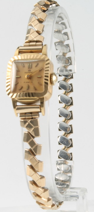 A lady's 18ct yellow gold Bucherer wristwatch on an expanding gilt bracelet 