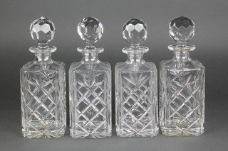 A set of 4 square spirit decanters and stoppers 10 1/2" 