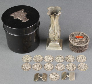 A Victorian silver spill vase with repousse decoration Chester 1895 3 1/2", a silver mounted ebony toilet box, a filigree box and counters and a pair of silver cufflinks 