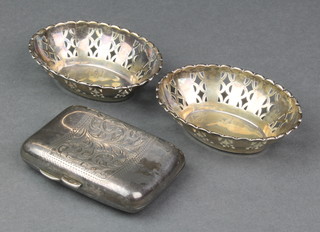 A pair of pierced silver oval bon bon dishes Birmingham 1925, 3" and a silver cigarette case 88 grams