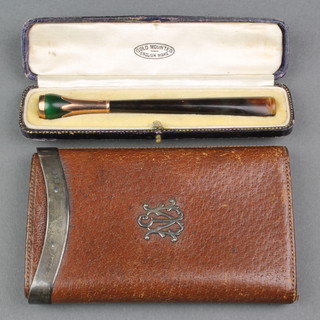 A gold mounted cigarette holder cased and a silver mounted leather cigar case 