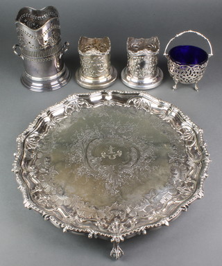 A pair of silver plated repousse siphon holders, a larger ditto, a sugar bowl with blue glass liner and  a fancy salver with ball feet 