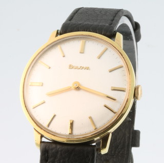 A gentleman's gilt cased Bulova wristwatch on a leather strap 
