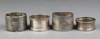 An engine turned silver napkin ring Sheffield 1955, 2 others and a plated ditto 66 grams