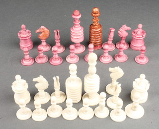 A turned and stained ivory chess set, the King 3 1/2" 
