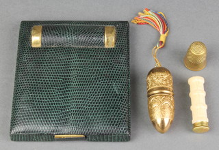 An Art Deco lizard skin folding compact lipstick holder and a needle case 