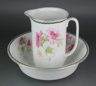 A Edwardian wash stand jug and basin decorated with flowers 