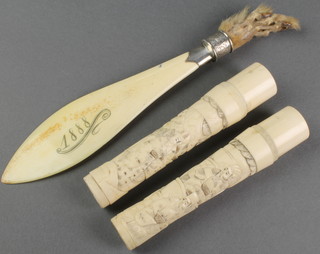 A pair of Japanese carved ivory parasol handles decorated with figures in garden landscapes 5" and a Victorian silver mounted ivory paper knife 9" 