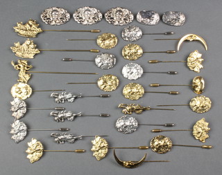 A collection of Art Nouveau style gilt and silver plated tie pins and brooches