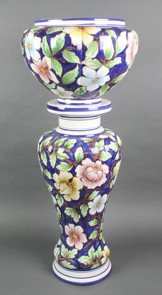 A contemporary Continental polychrome jardiniere and stand decorated with flowers 24" 