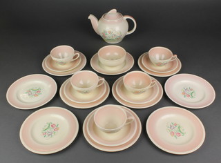A Susie Cooper part tea set decorated with stylised flowers comprising teapot, sugar bowl, 5 cups, 5 saucers, 10 side plates 