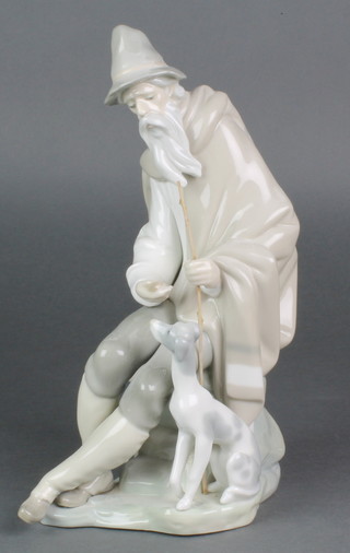 A Lladro figure of a seated gentleman with hound 11 1/2"  