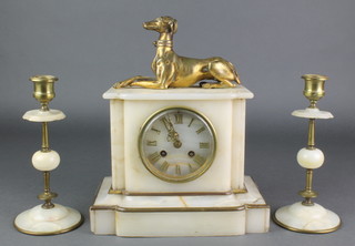 A Victorian French 8 day striking mantel clock with Roman numerals contained in a white marble case surmounted by a figure of a reclining greyhound together with 2 matching candlesticks (chipped) 