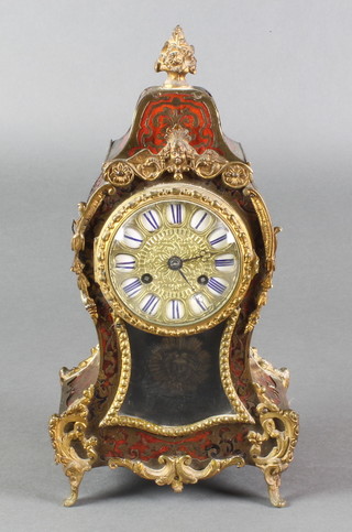 A 19th Century French striking mantel clock, contained in a red boulle and gilt mounted case 12" 