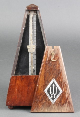 A German metronome contained in a mahogany case 