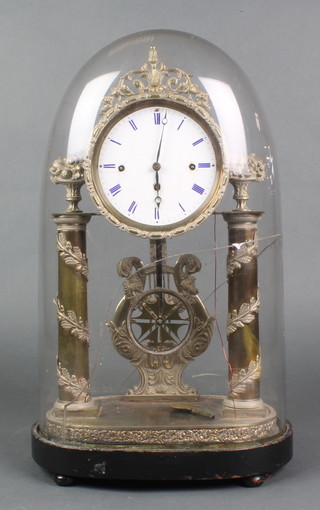 A Victorian 8 day chiming mantel clock with enamelled dial and Roman numerals supported by 2 columns with acorn decoration and having pierced star shaped pendulum complete with glass dome 