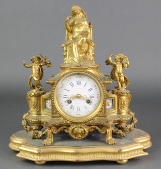 J Silvani Paris, a 19th Century French 8 day striking mantel clock, the enamelled dial with Roman numerals contained in a gilt ormolu case surmounted by a figure of a seated lady and having "Sevres" panels to the sides 