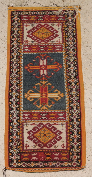 A yellow and blue ground Turkish style runner 53" x 24" 