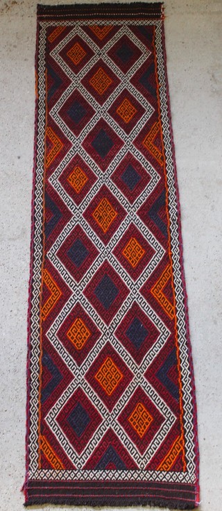 A contemporary Kelim runner with oval geometric design 107" x 28" 
