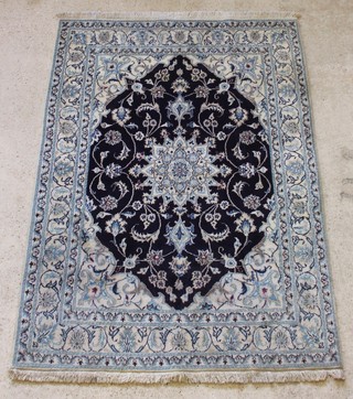 A blue and white ground Nain rug with central medallion 80" x 59" 
