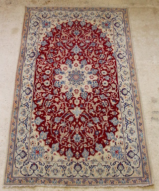 A white, brown and floral ground Main carpet with central medallion 101" x 61"  