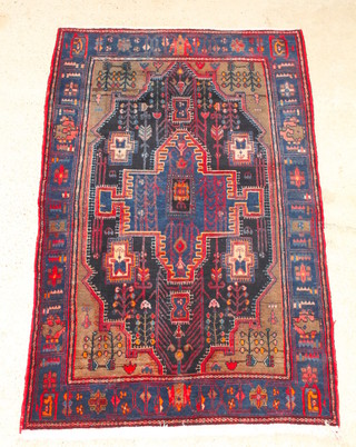 A Persian blue ground Toyserkan rug with central medallion 85" x 55" 