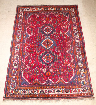 A brown, green and white ground Persian Qashqai carpet 122" x 87" 