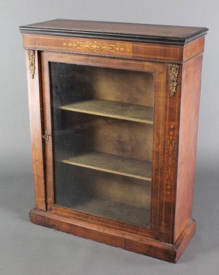 A Victorian walnut pier cabinet enclosed by panelled doors, inlaid satinwood stringing throughout and having gilt metal mounts 35"h x 30"w x 11 1/2"d 