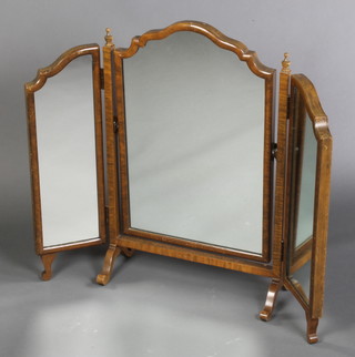 A Queen Anne style triple plate dressing table mirror contained in an arched walnut frame 25"h x 31"w