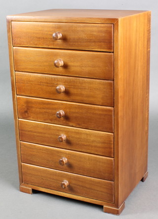 A rectangular mahogany table top chest of 7 long drawers with tore handles, raised on bracket feet 16 /2"h x 10"w x 8"d 