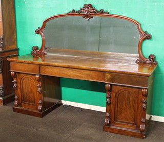 A Victorian mahogany pedestal sideboard with arch shaped mirrored back, the base fitted 1 long drawer, the pedestals fitted 1 short drawer above cupboards enclosed by arched panelled doors with vitruvian scrolls 70"h x 89"w x 27"d 