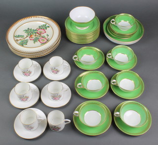 A Spode green and gilt tea set comprising 7 tea cups, 10 saucers, slop bowl, 2 shallow dishes and 10 side plates together with a Royal Worcester coffee set with 6 coffee cans and 5 saucers and 5 Edwardian dinner plates 