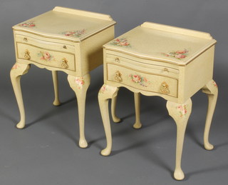 A pair of Continental style white and floral painted bedside tables of serpentine outline with raised back fitted brushing slide above 1 long drawer, raised on cabriole supports with floral decoration 23"h x 16"w x 12"d 