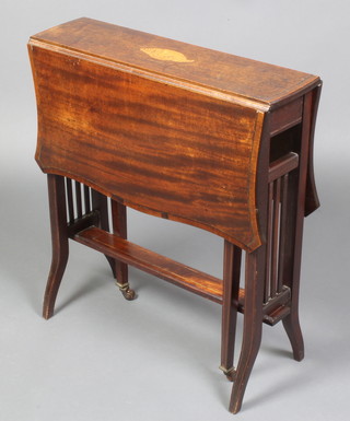 An Edwardian inlaid mahogany Sutherland table of serpentine outline the top inlaid cross banding and satinwood stringing 26"h x 24"w x 6 1/2" when closed x 29 1/2" when open 