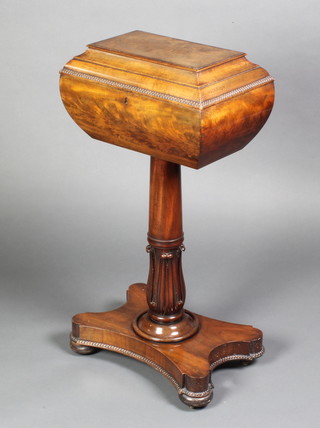 A Regency mahogany teapoy of sarcophagus form, raised on turned column with triform base, (no interior) now converted to a work table 30"h x 16"d x 10"w 